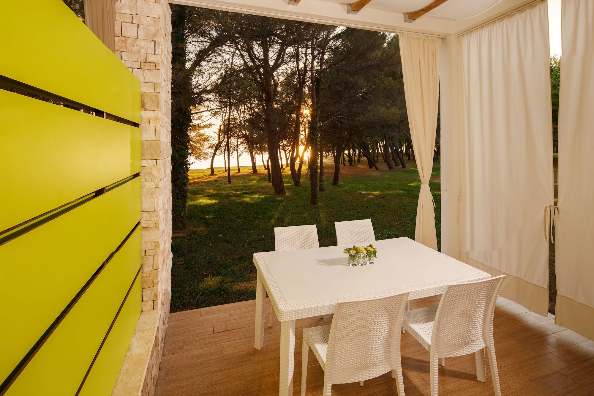 a table and chairs on a porch