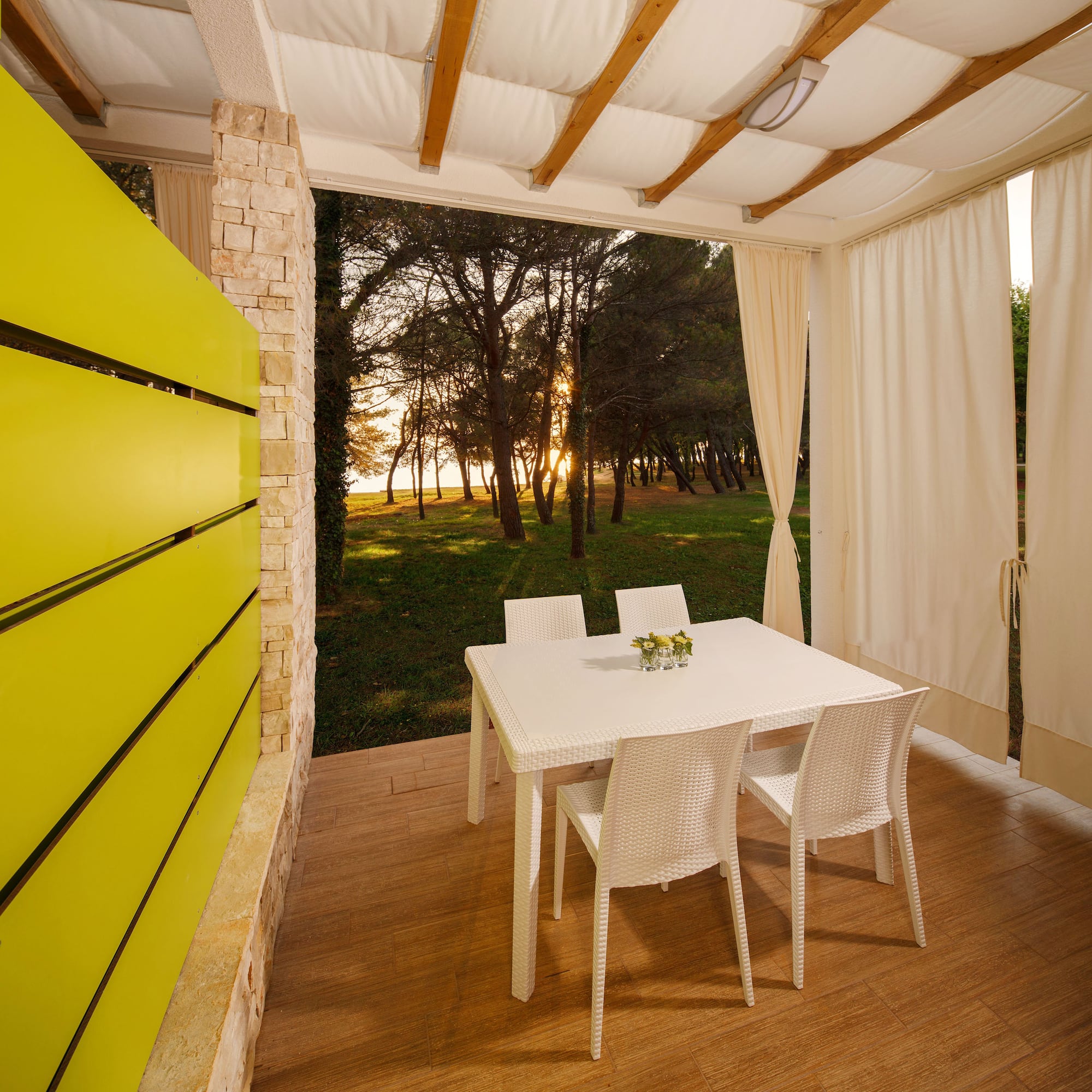 a table and chairs on a porch