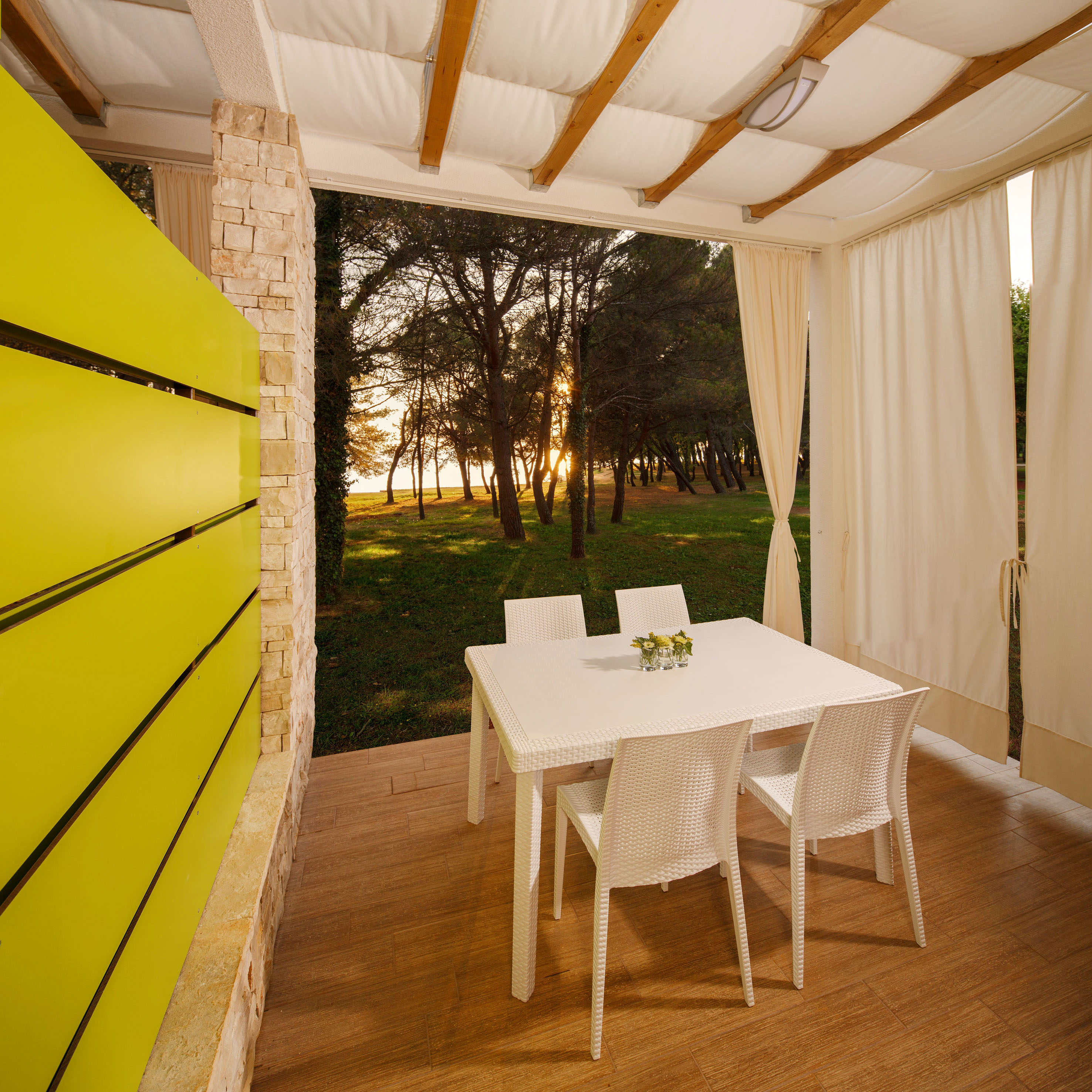 a table and chairs on a porch