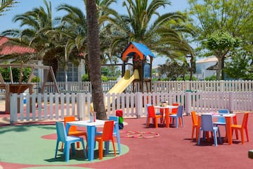 a playground with tables and chairs