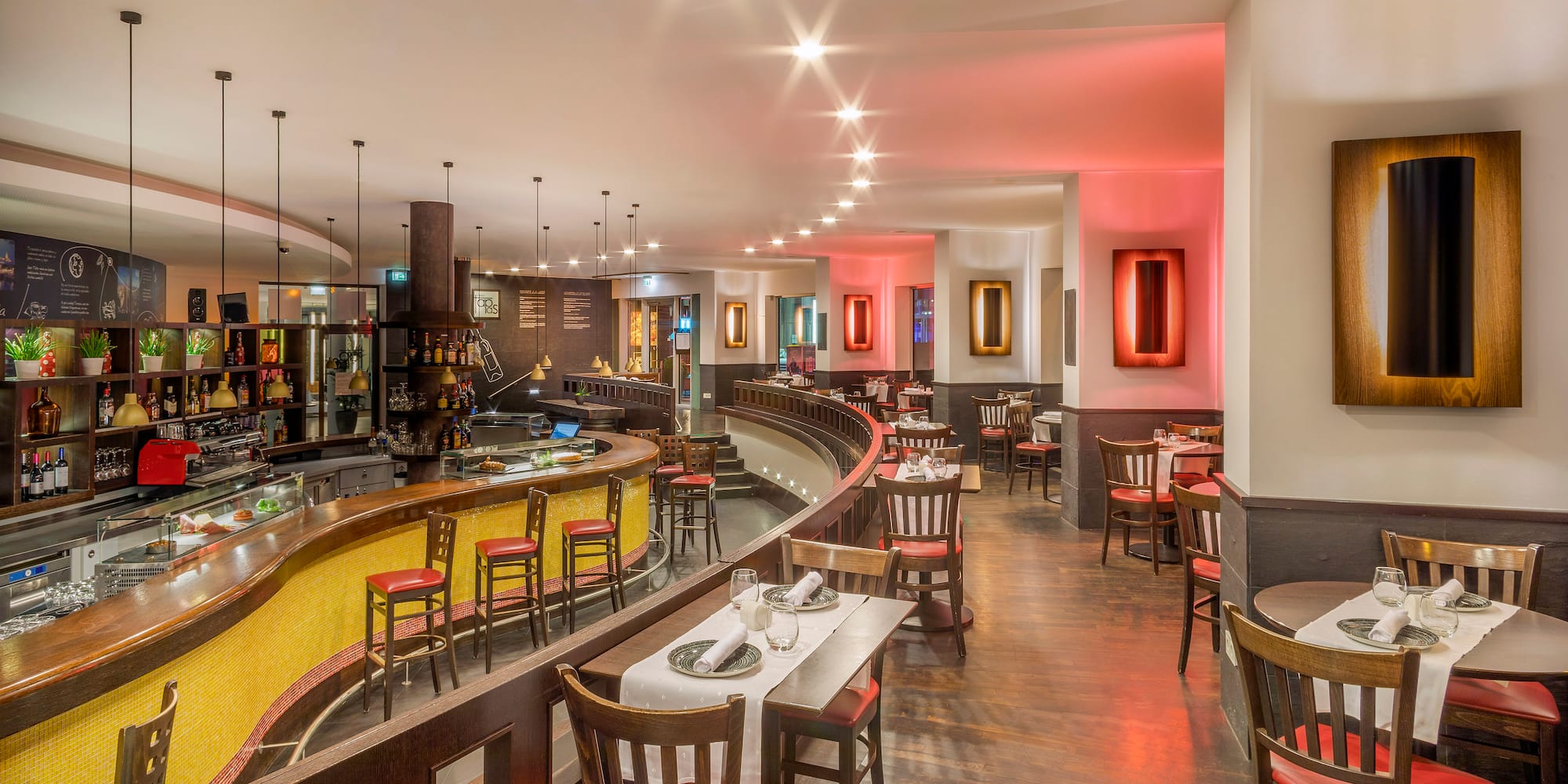 a restaurant with tables and chairs