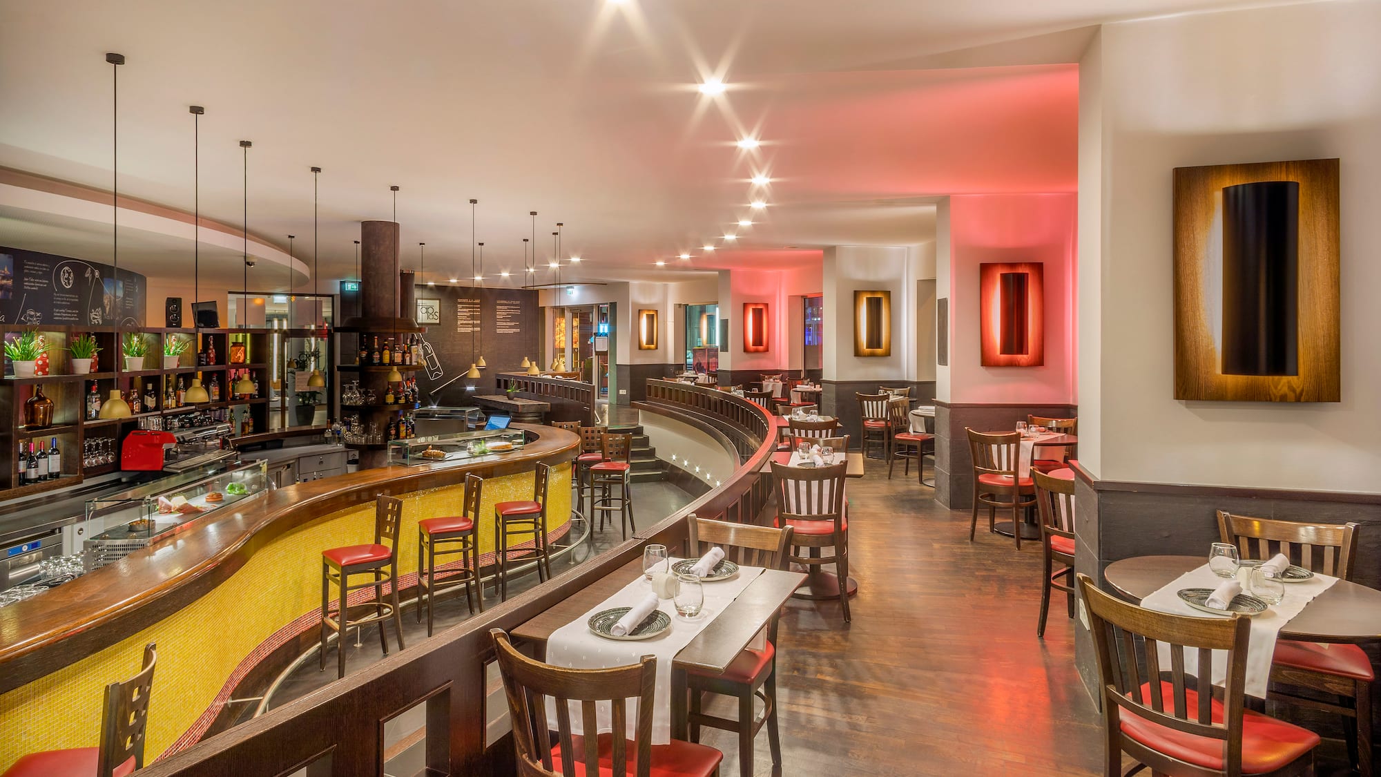 a restaurant with tables and chairs