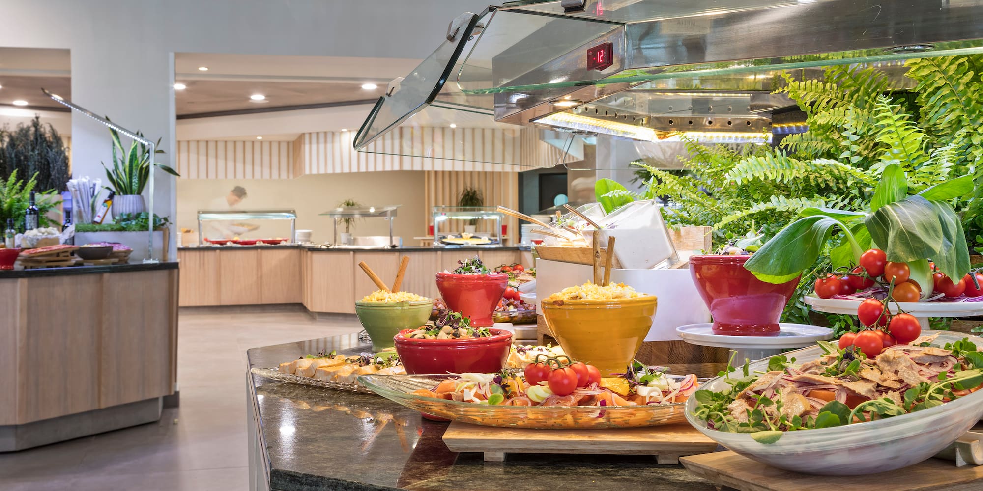 a buffet table with food in bowls