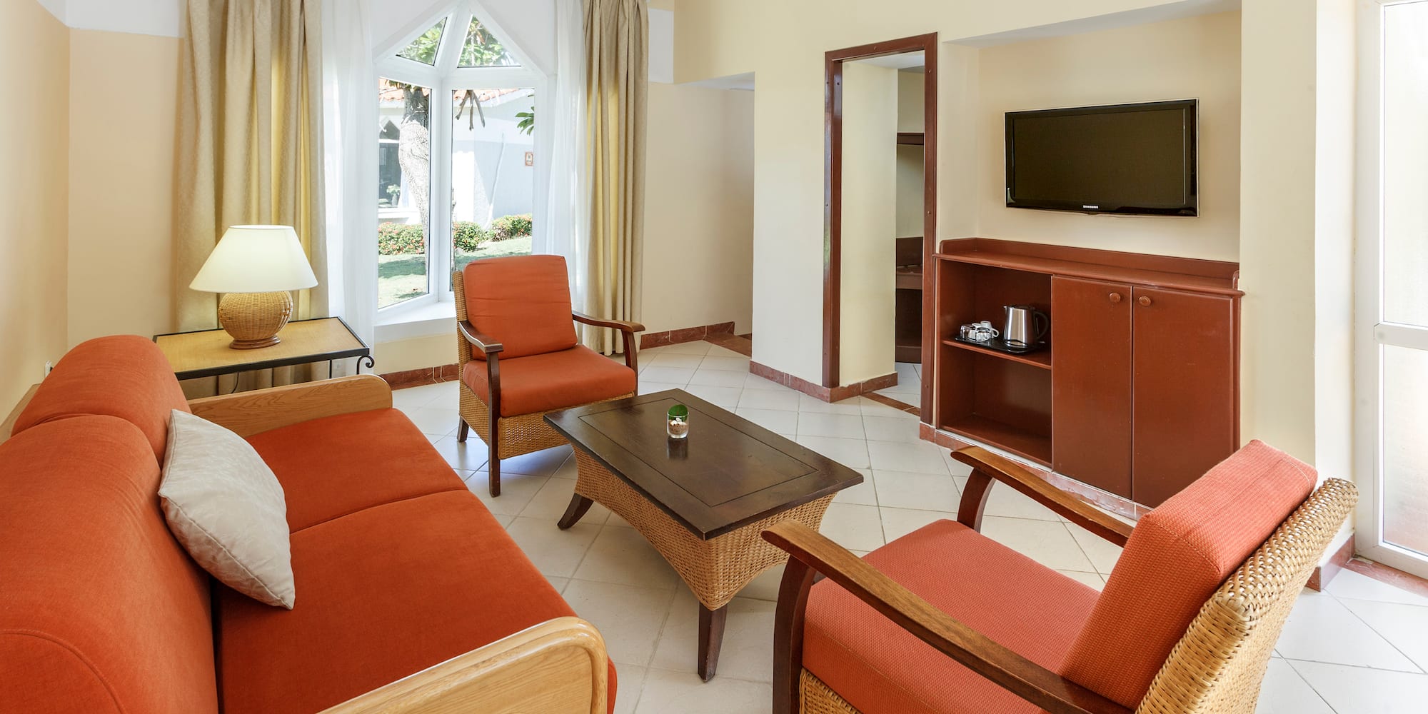 a living room with a television and a couch