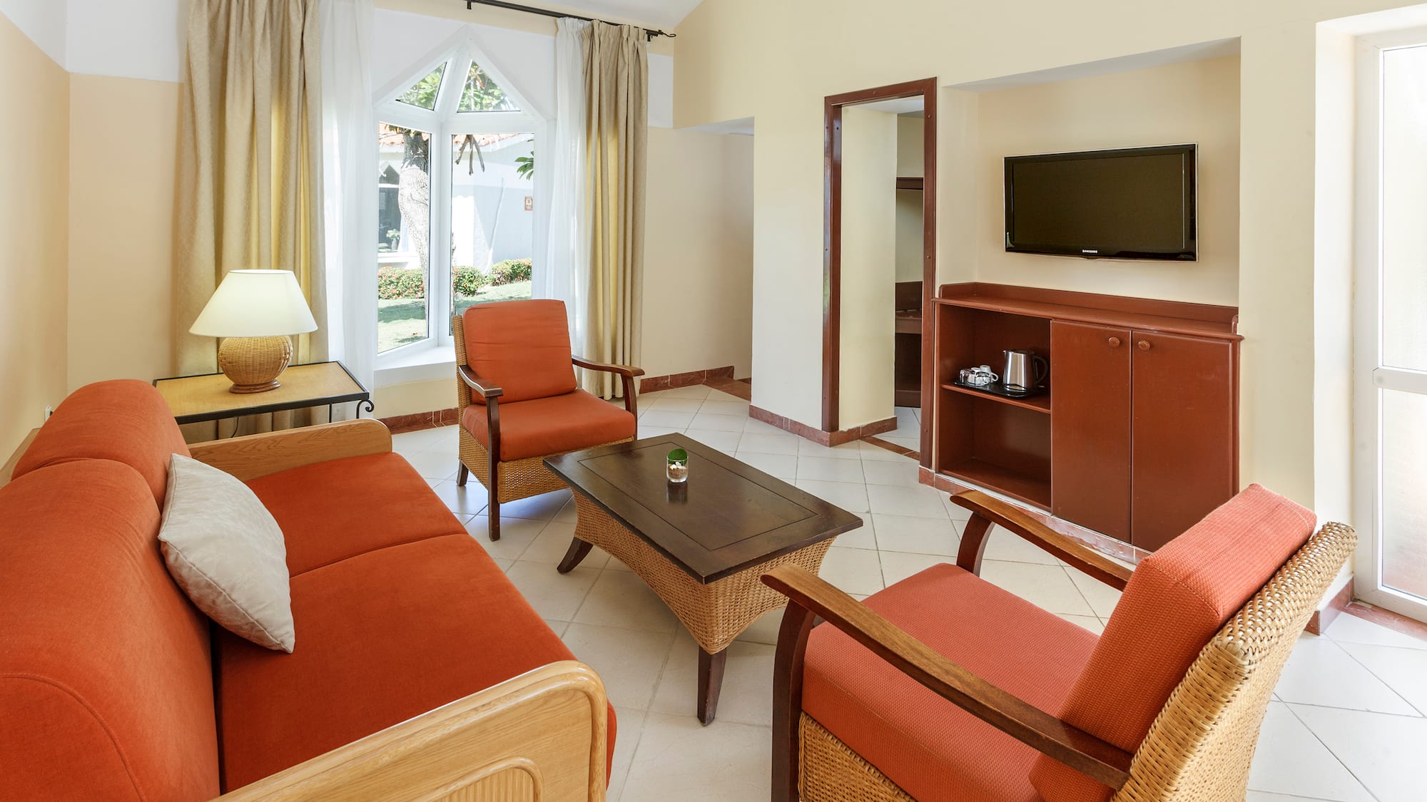 a living room with a television and a couch