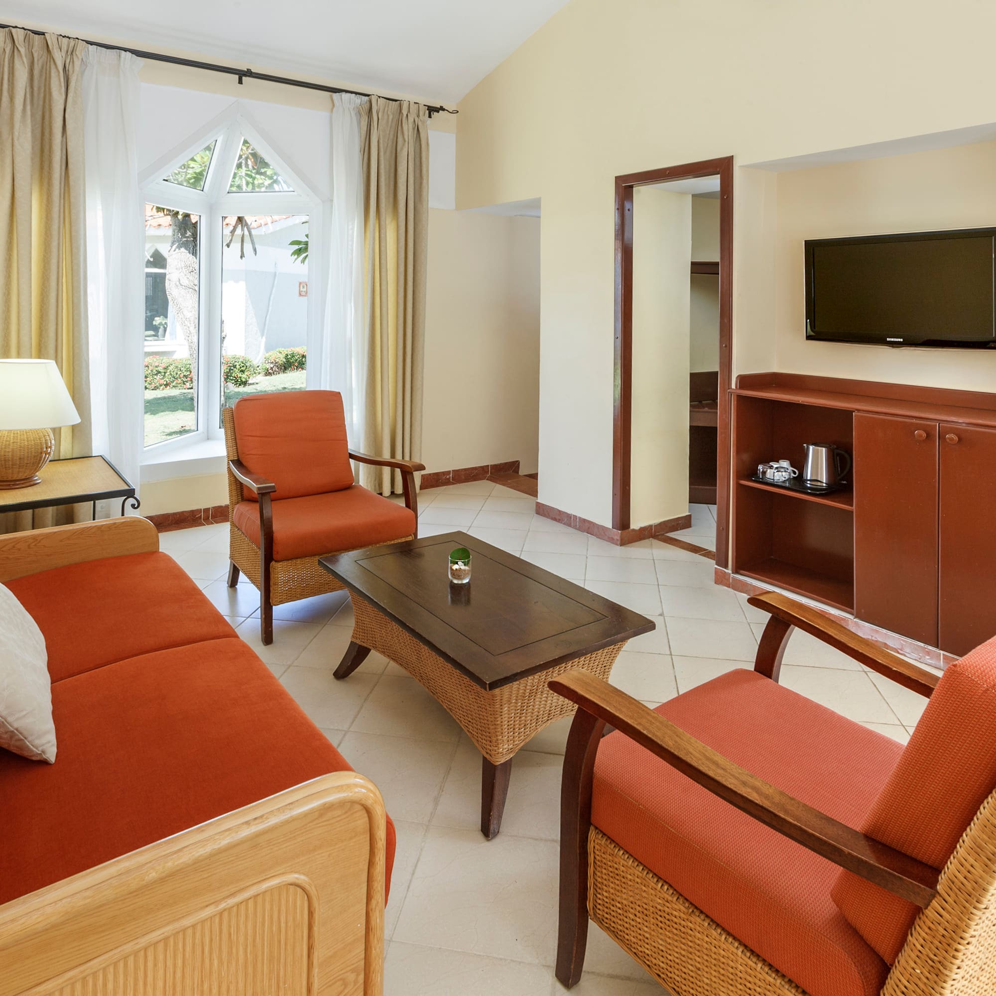 a living room with a television and a couch