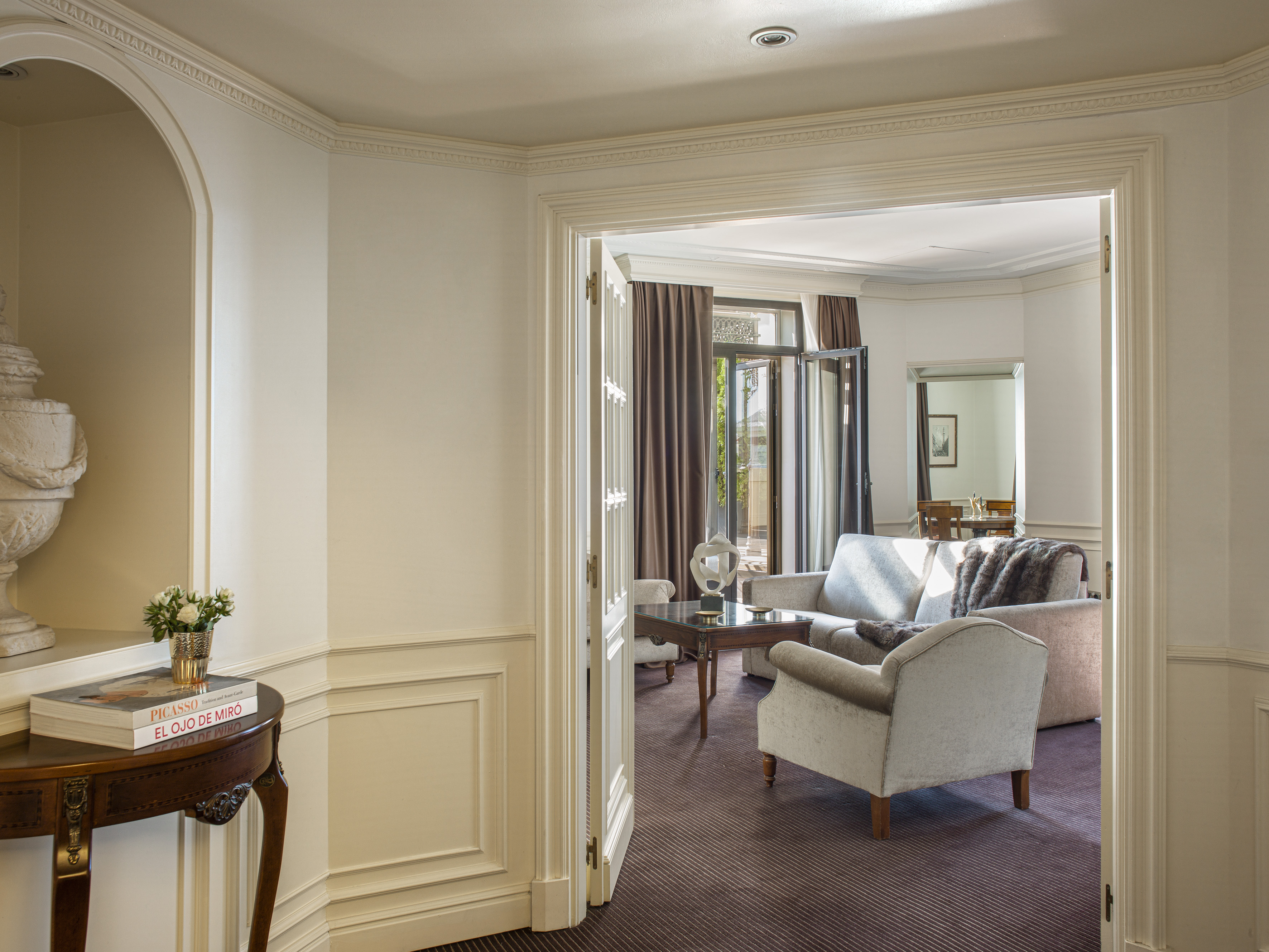 Treat yourself to an immersive experience with the RedLevel luxury service a room with a couch and a table