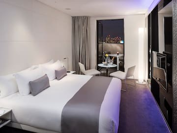 a room with a bed and a tv
