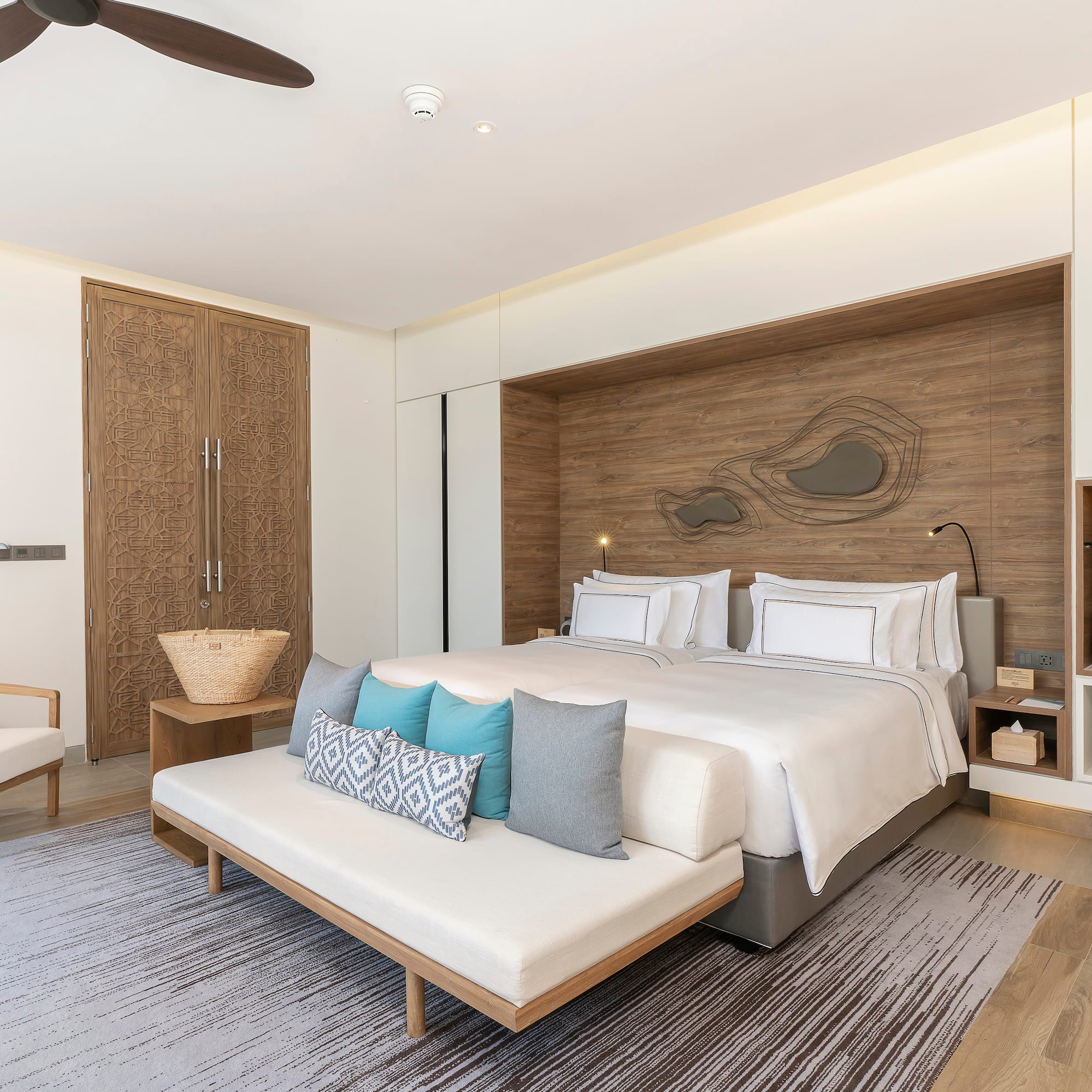 a bedroom with a bed and a fan