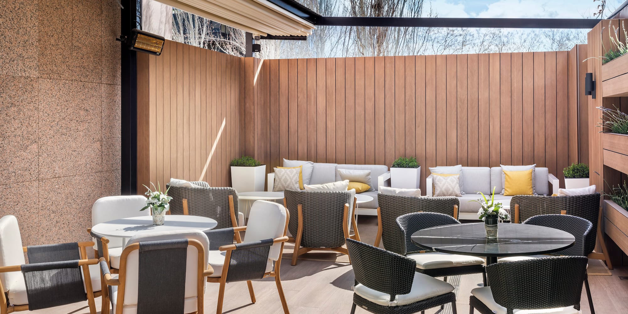 a patio with chairs and tables