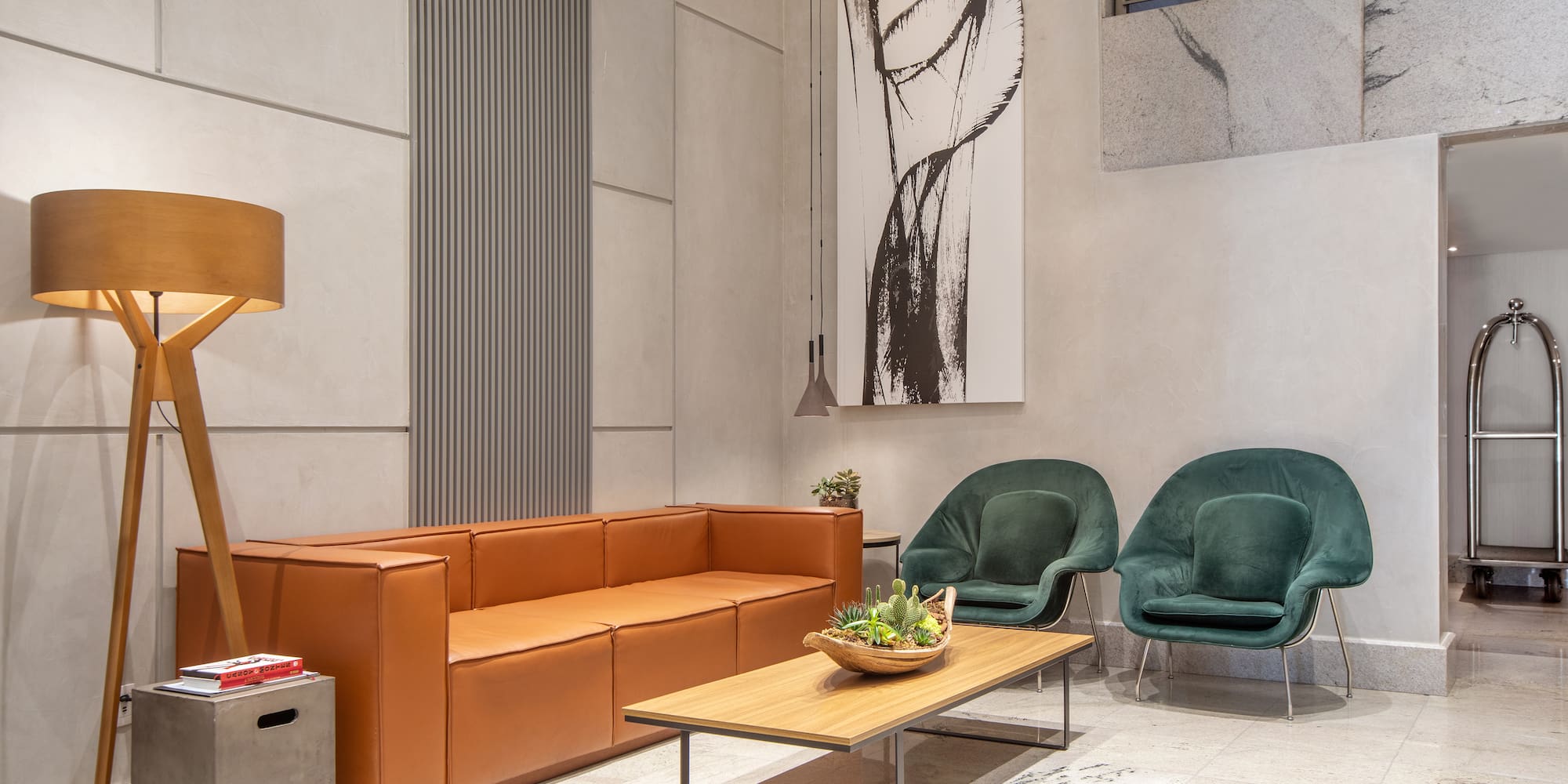 a room with a couch and chairs