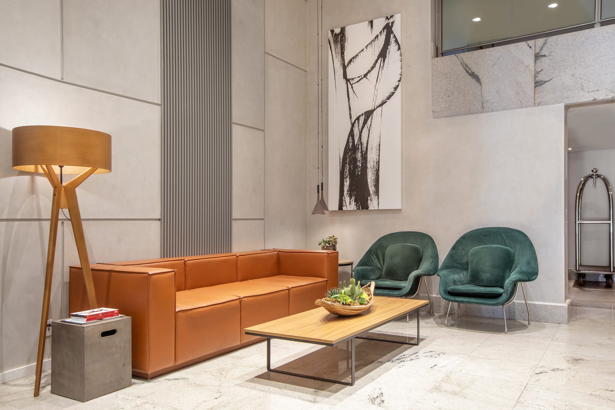 a room with a couch and chairs