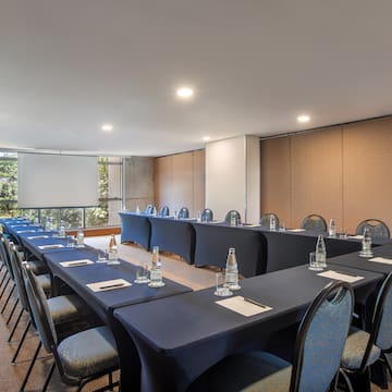 a room with tables and chairs