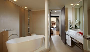 a bathroom with a tub and sink