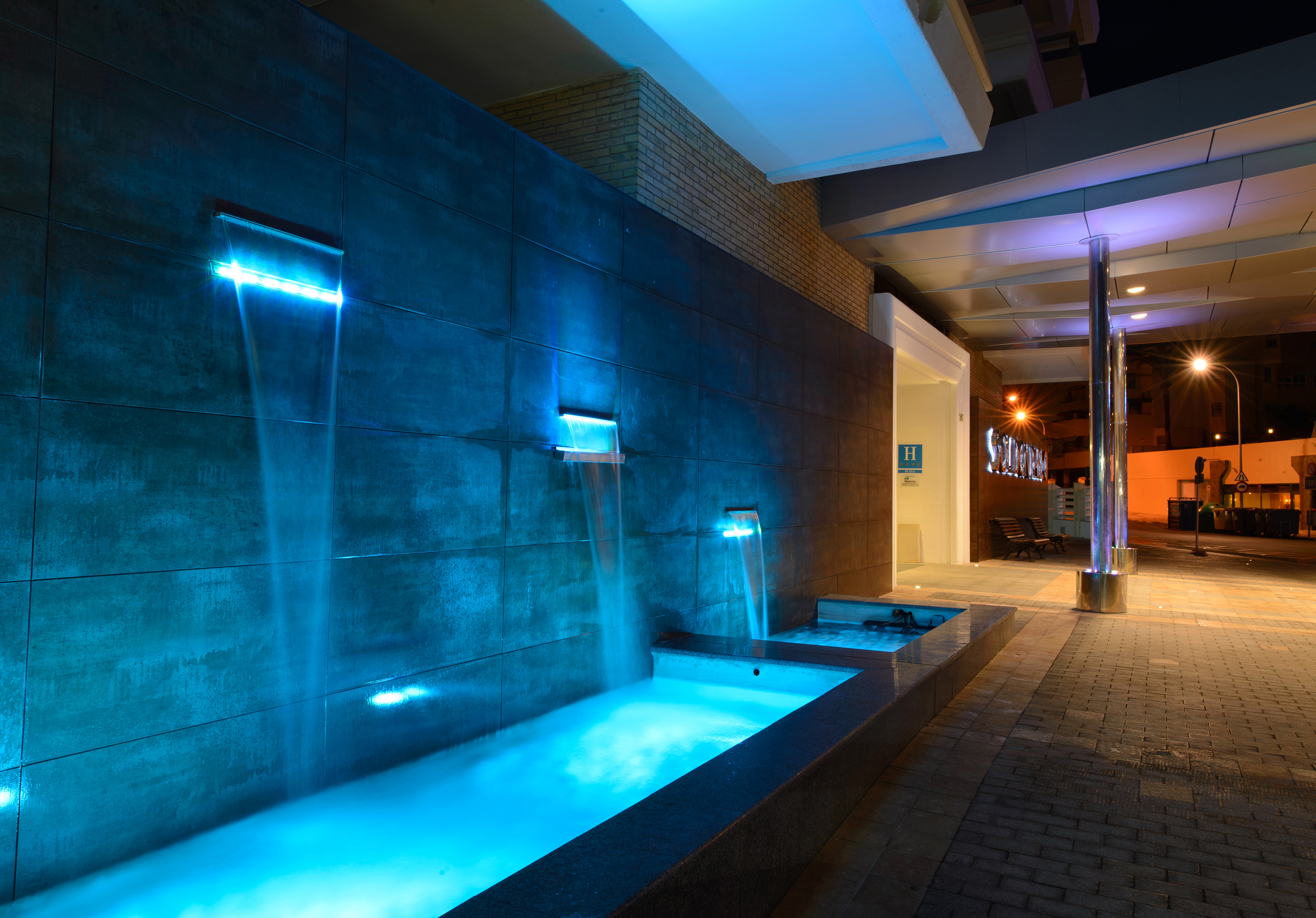 a water fountain with blue lights