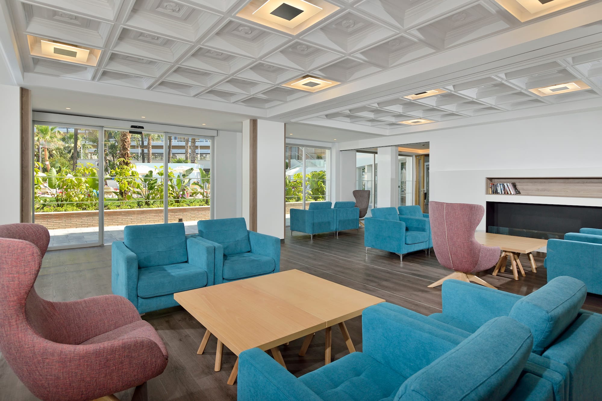 a room with blue chairs and a table
