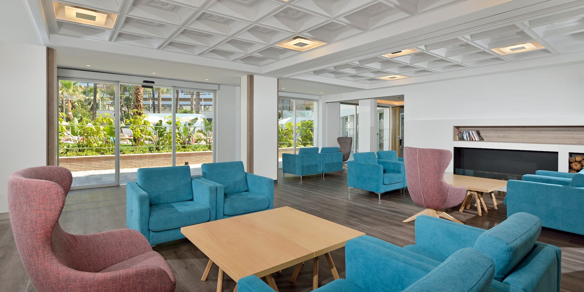 a room with blue chairs and a table