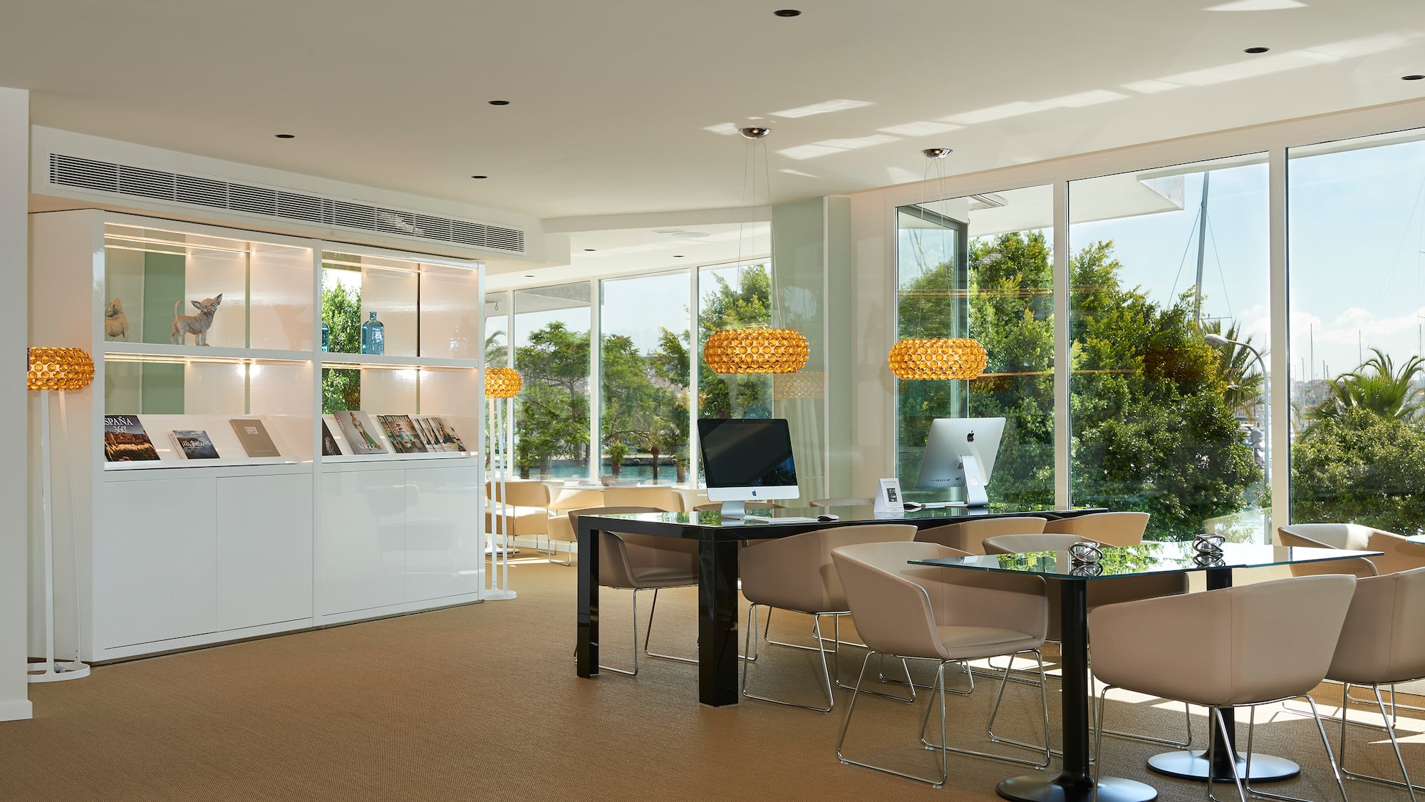 a room with a computer and a table