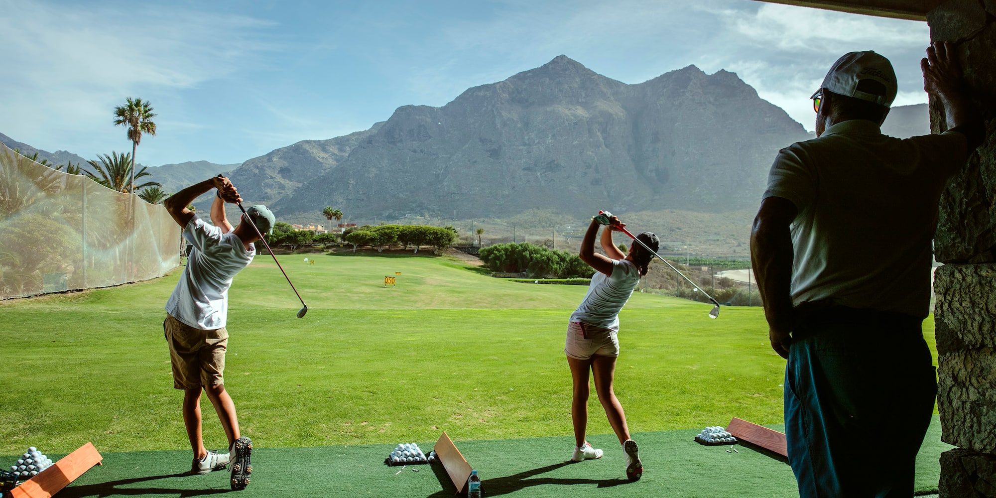 a group of people playing golf