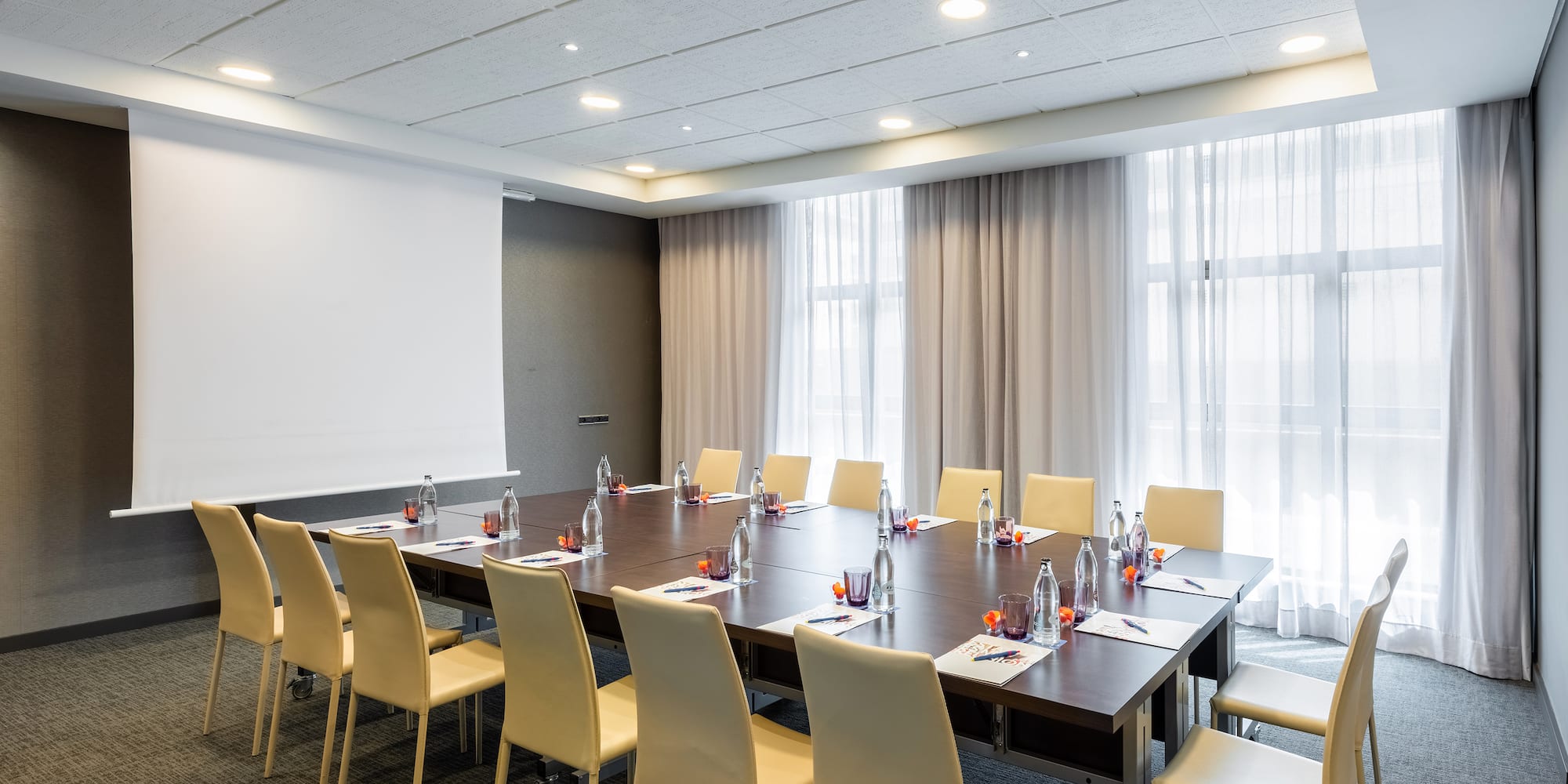 a conference room with a table and chairs