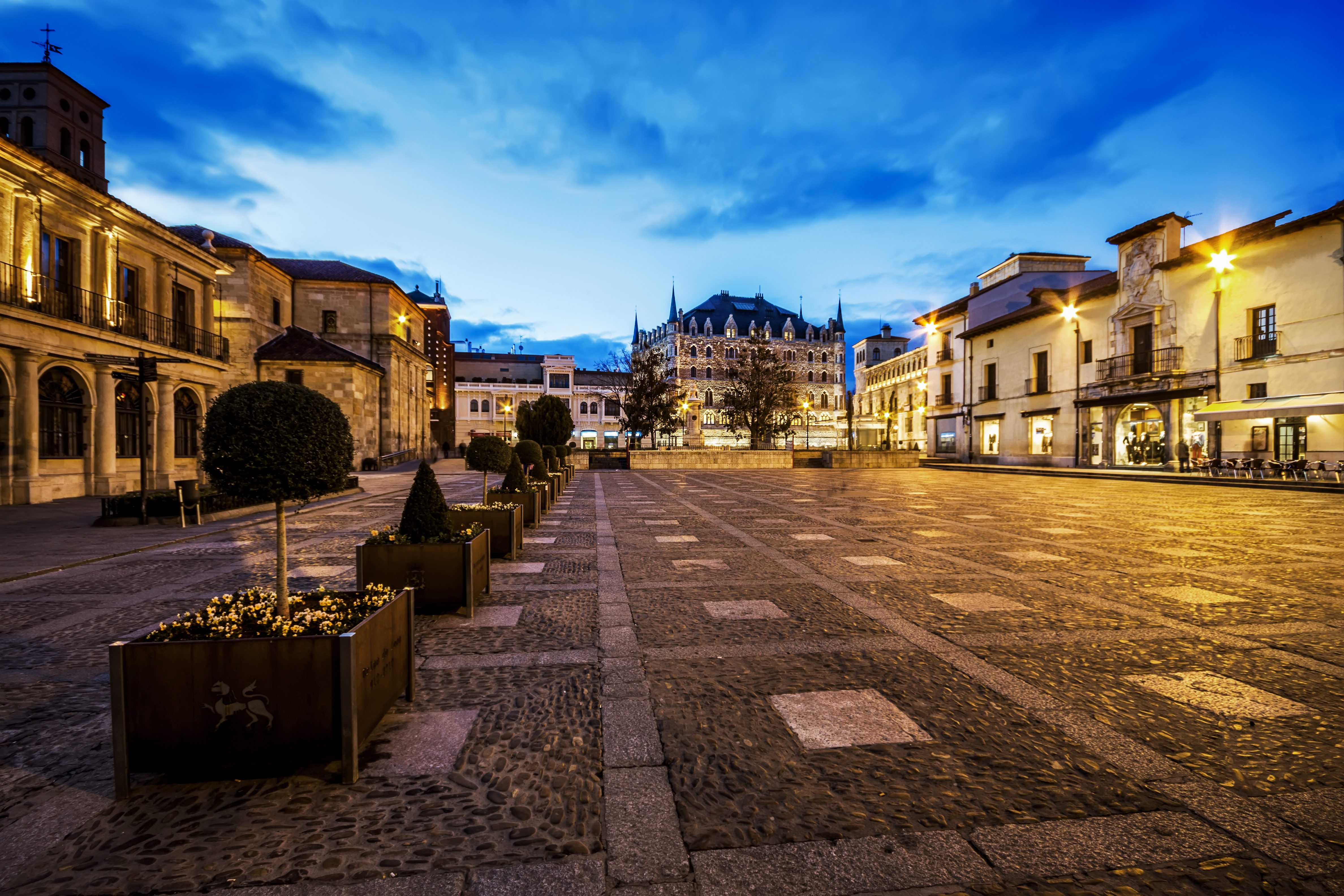 a courtyard with a building in the background