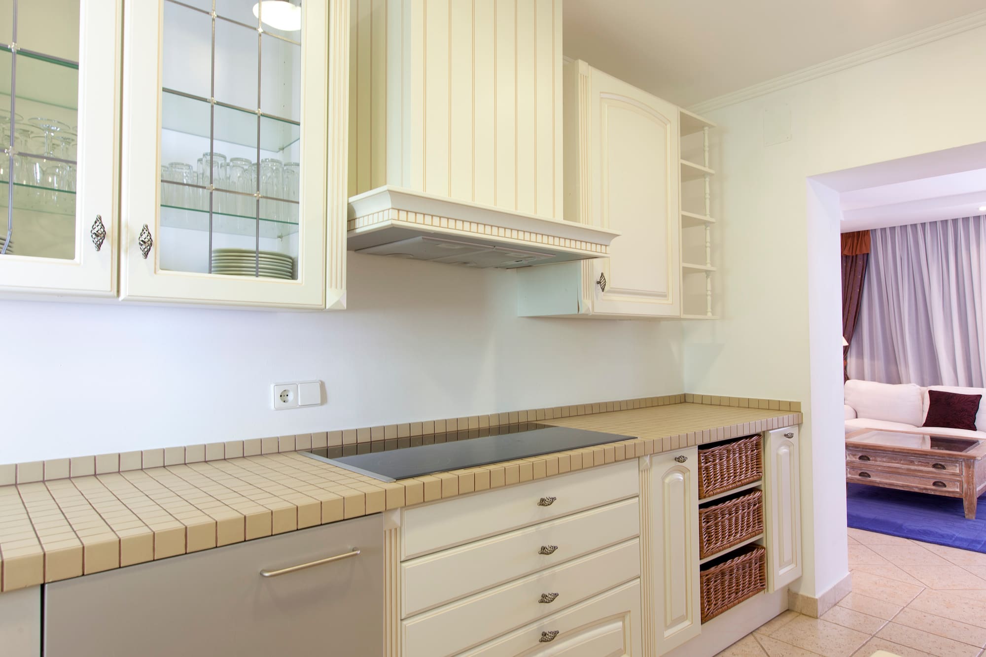 a kitchen with white cabinets and white counter tops