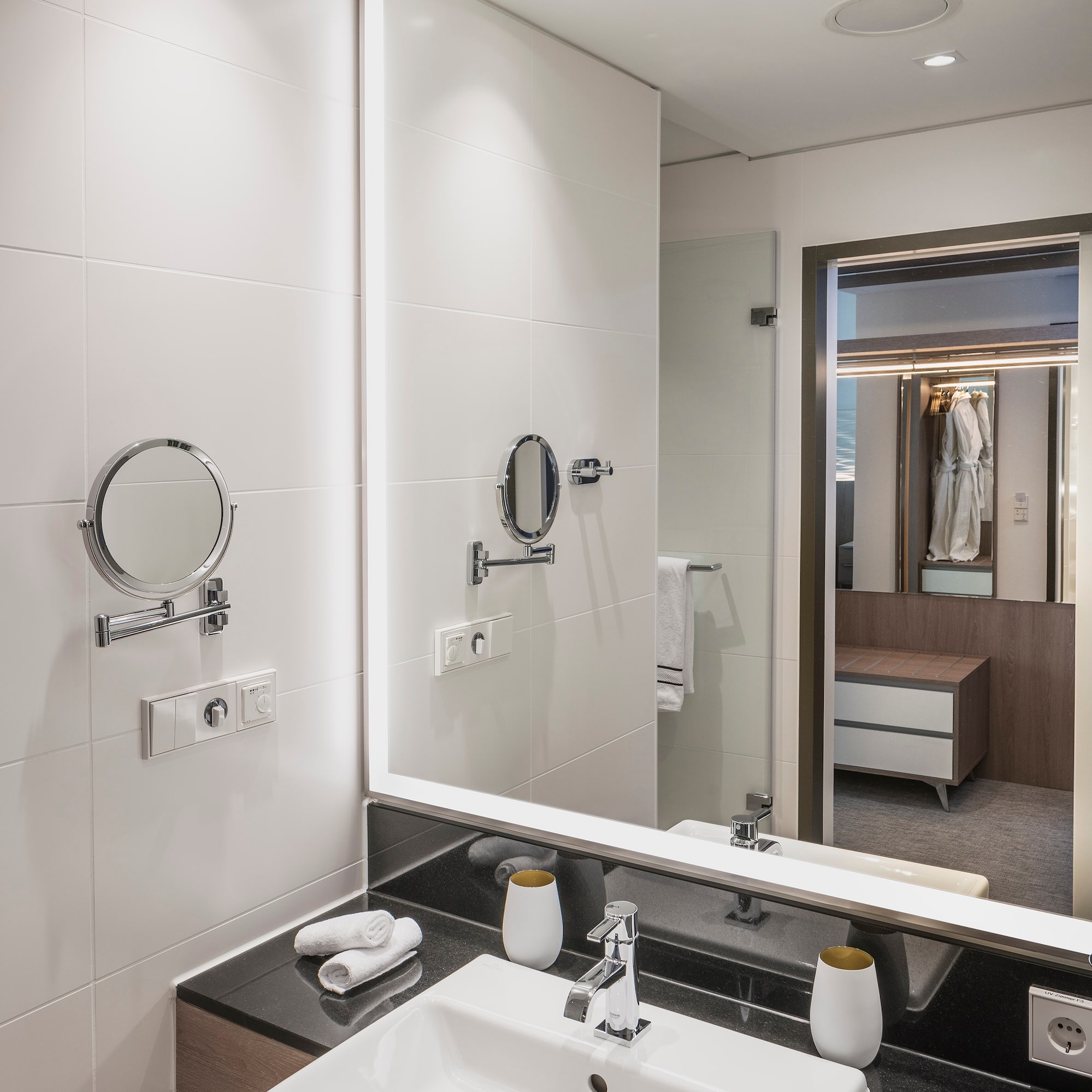 a bathroom with a mirror and sink