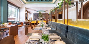 a restaurant with tables and chairs