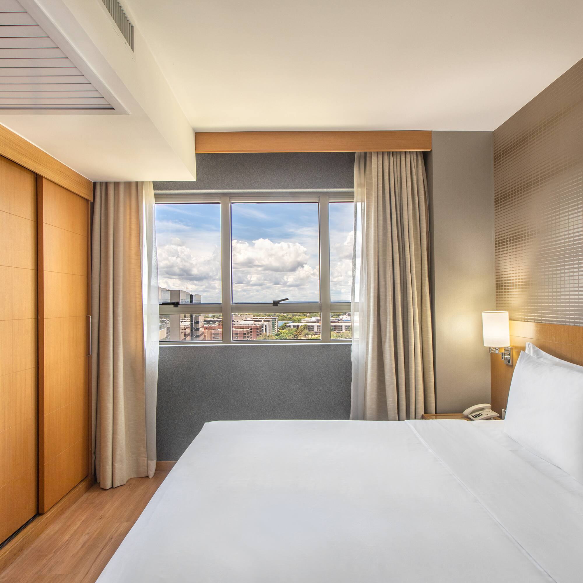 a room with a bed and closets