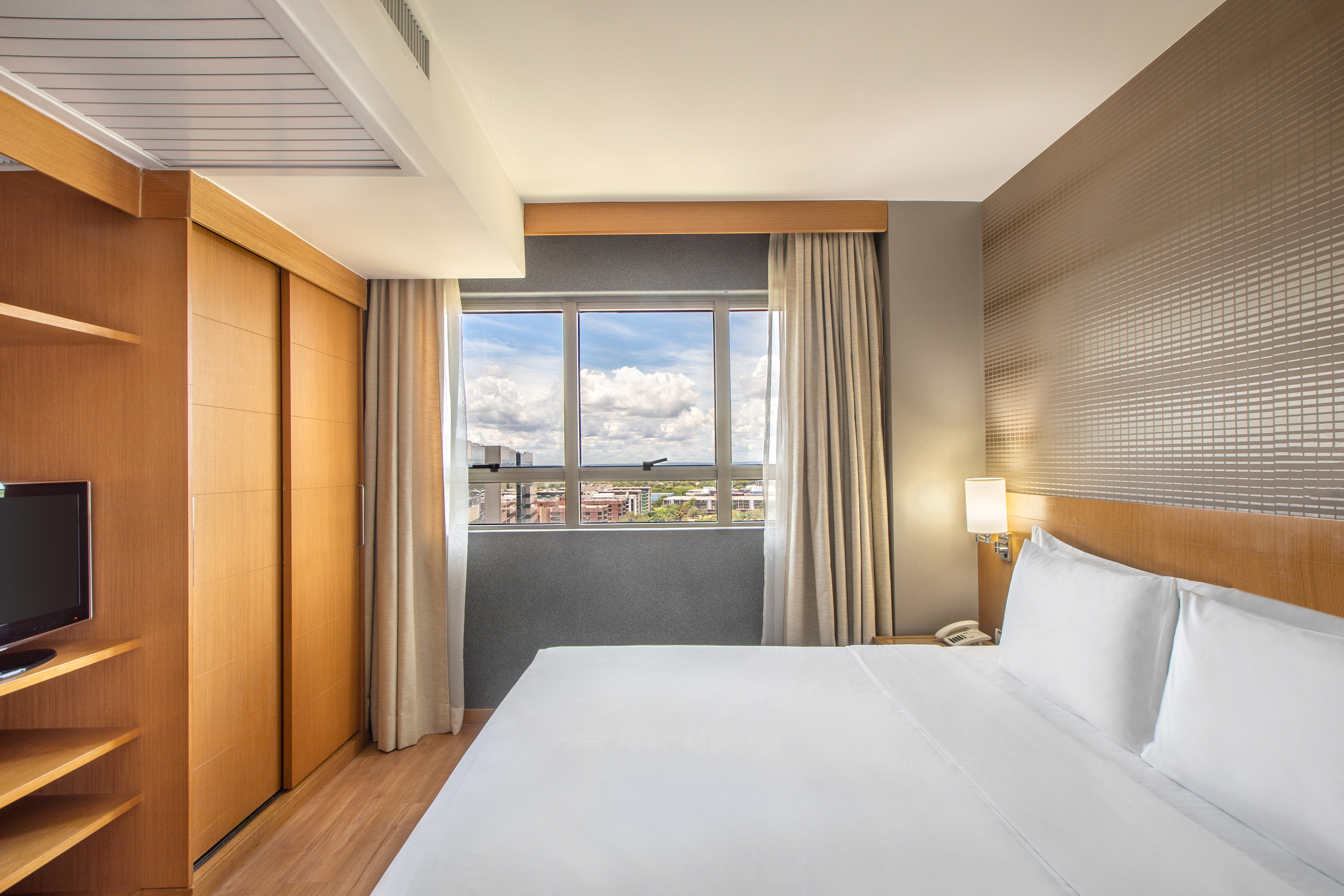 a room with a bed and closets