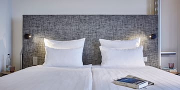 a bed with a book on it