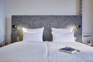 a bed with a book on it