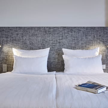 a bed with a book on it