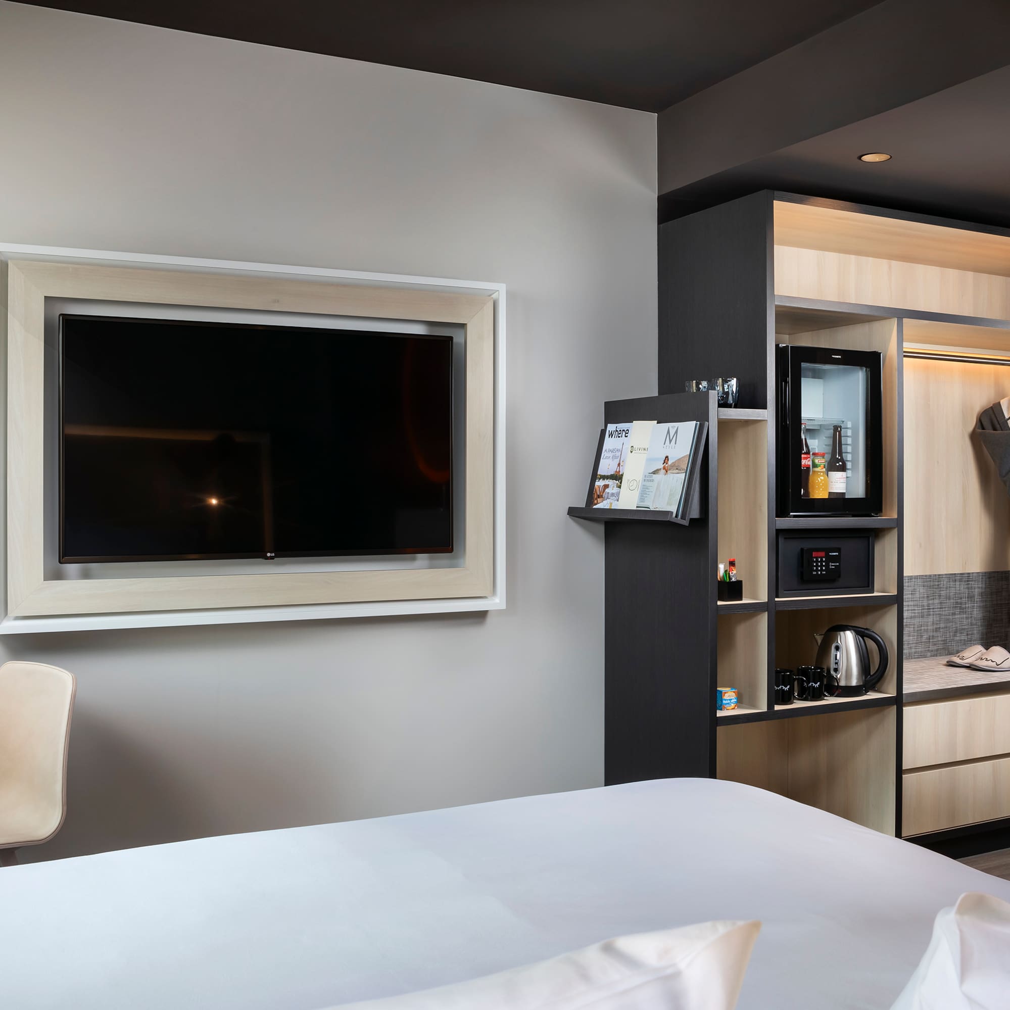 a room with a tv and a shelf