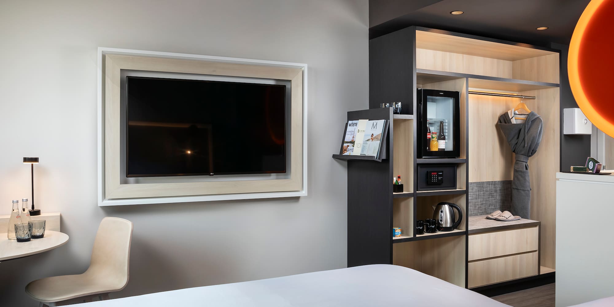 a room with a tv and a shelf