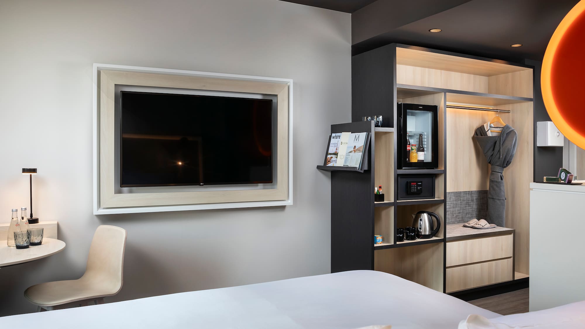 a room with a tv and a shelf