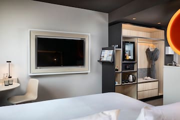 a room with a tv and a shelf