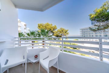 a white chairs on a balcony