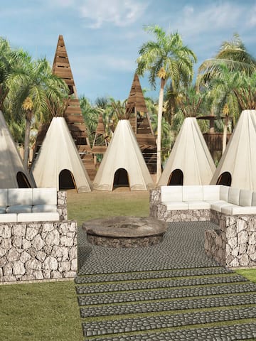 a group of teepees and a stone patio