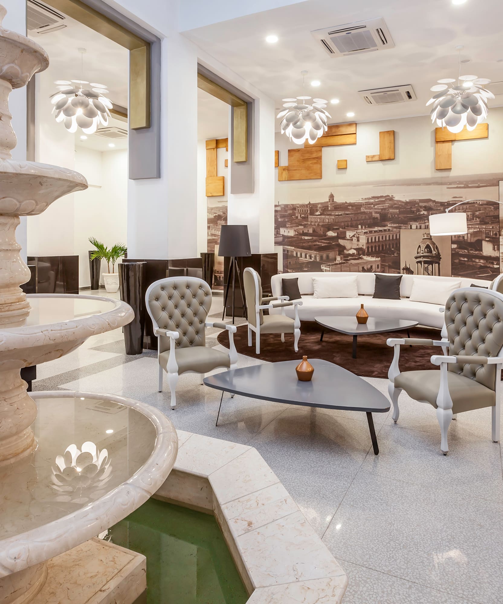 a room with a fountain and a couch