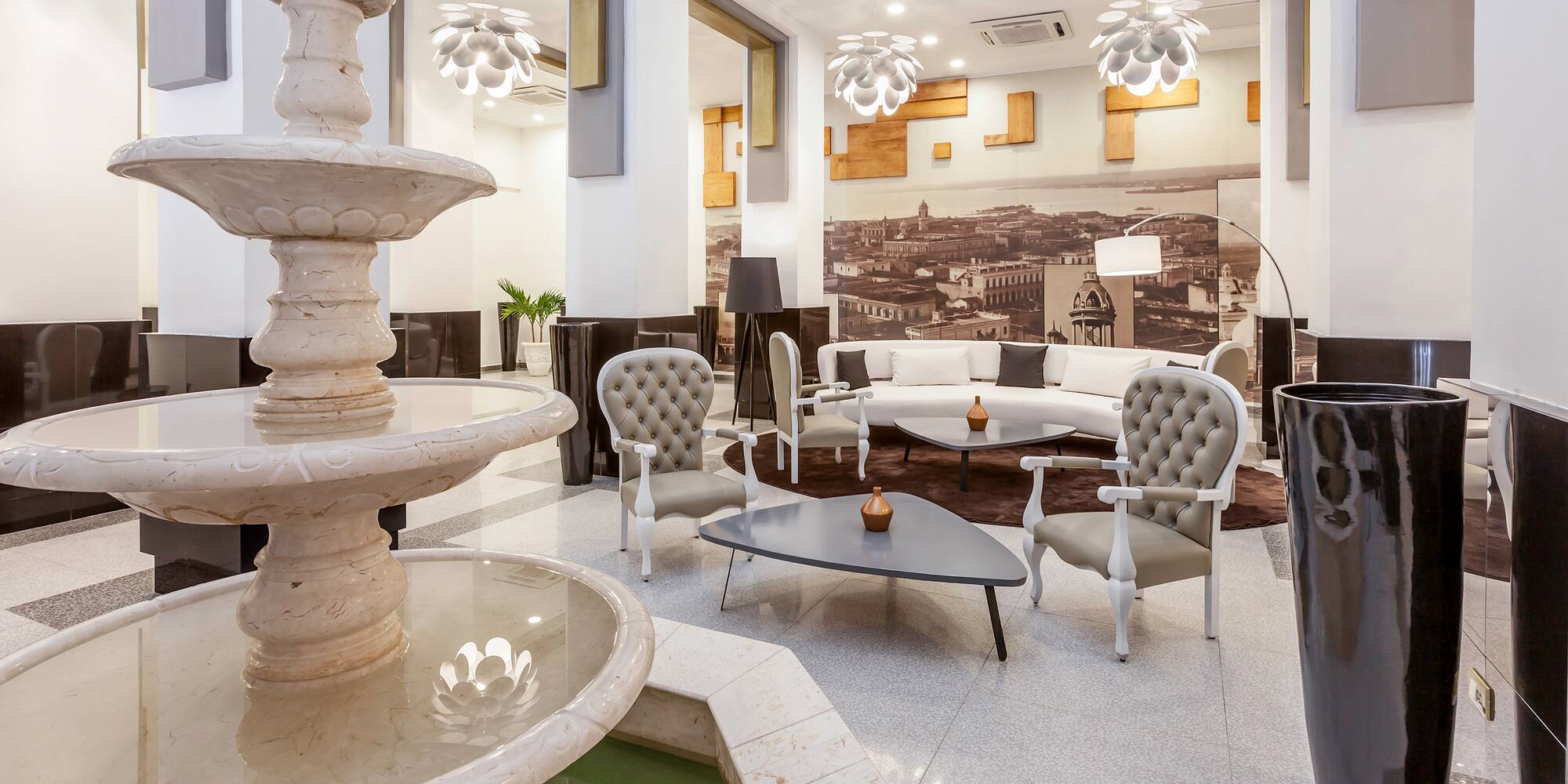 a room with a fountain and a couch