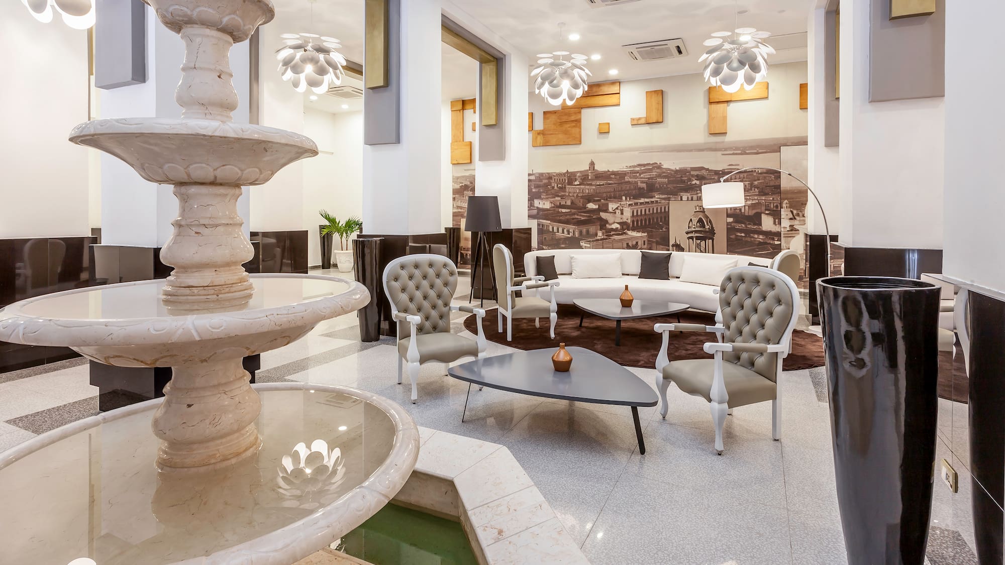 a room with a fountain and a couch