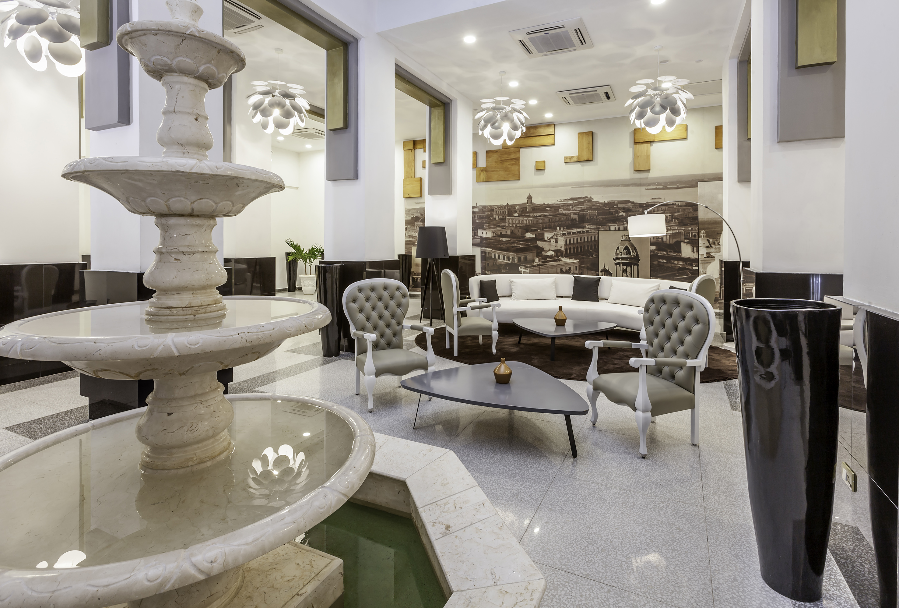 a room with a fountain and a couch