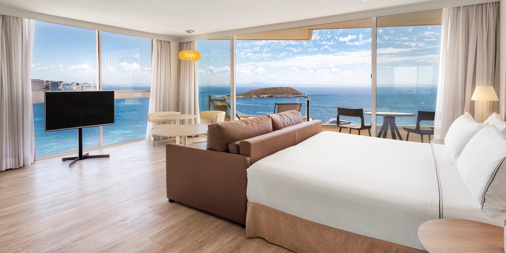 a room with a large window overlooking the ocean
