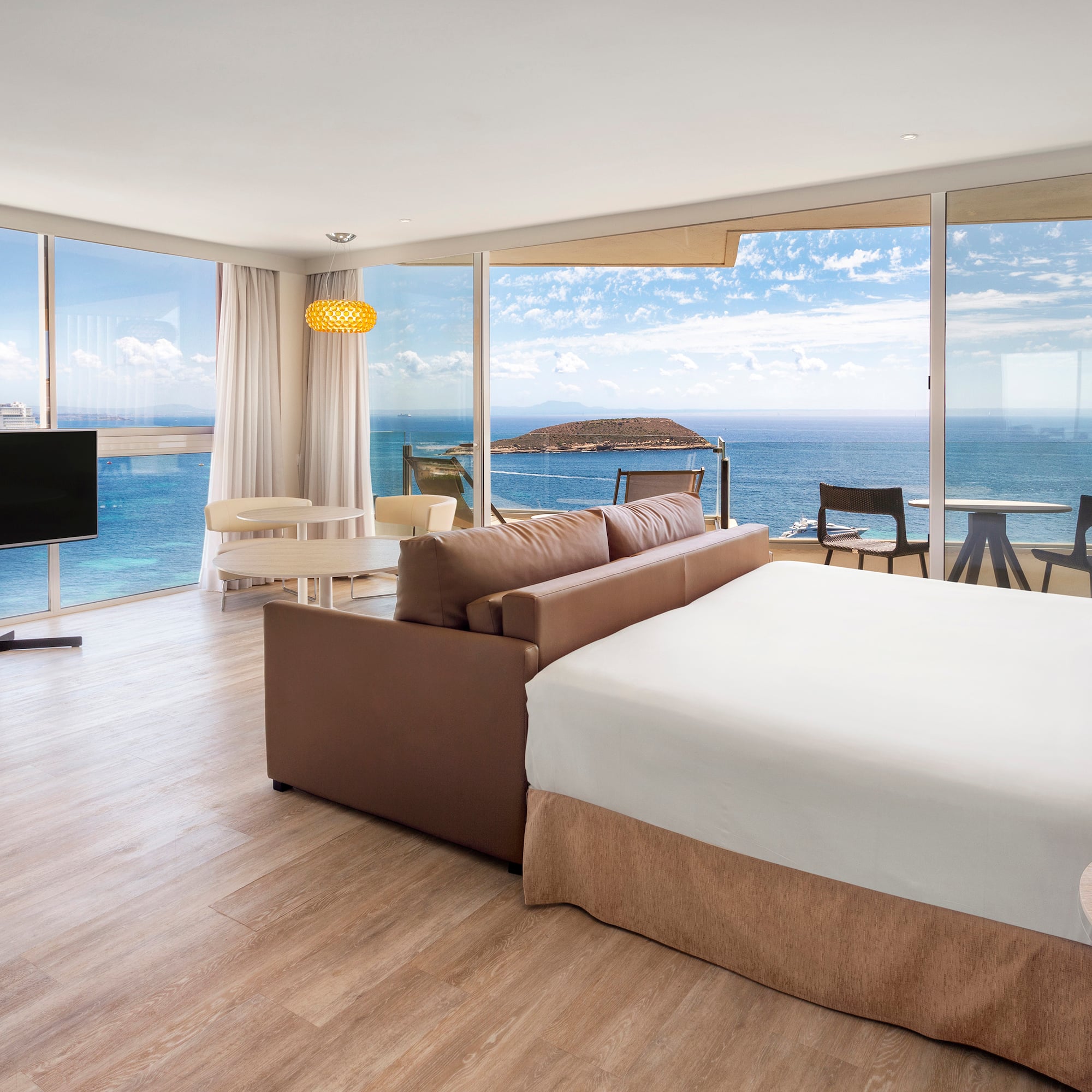 a room with a large window overlooking the ocean