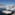 boats in a harbor with buildings in the background