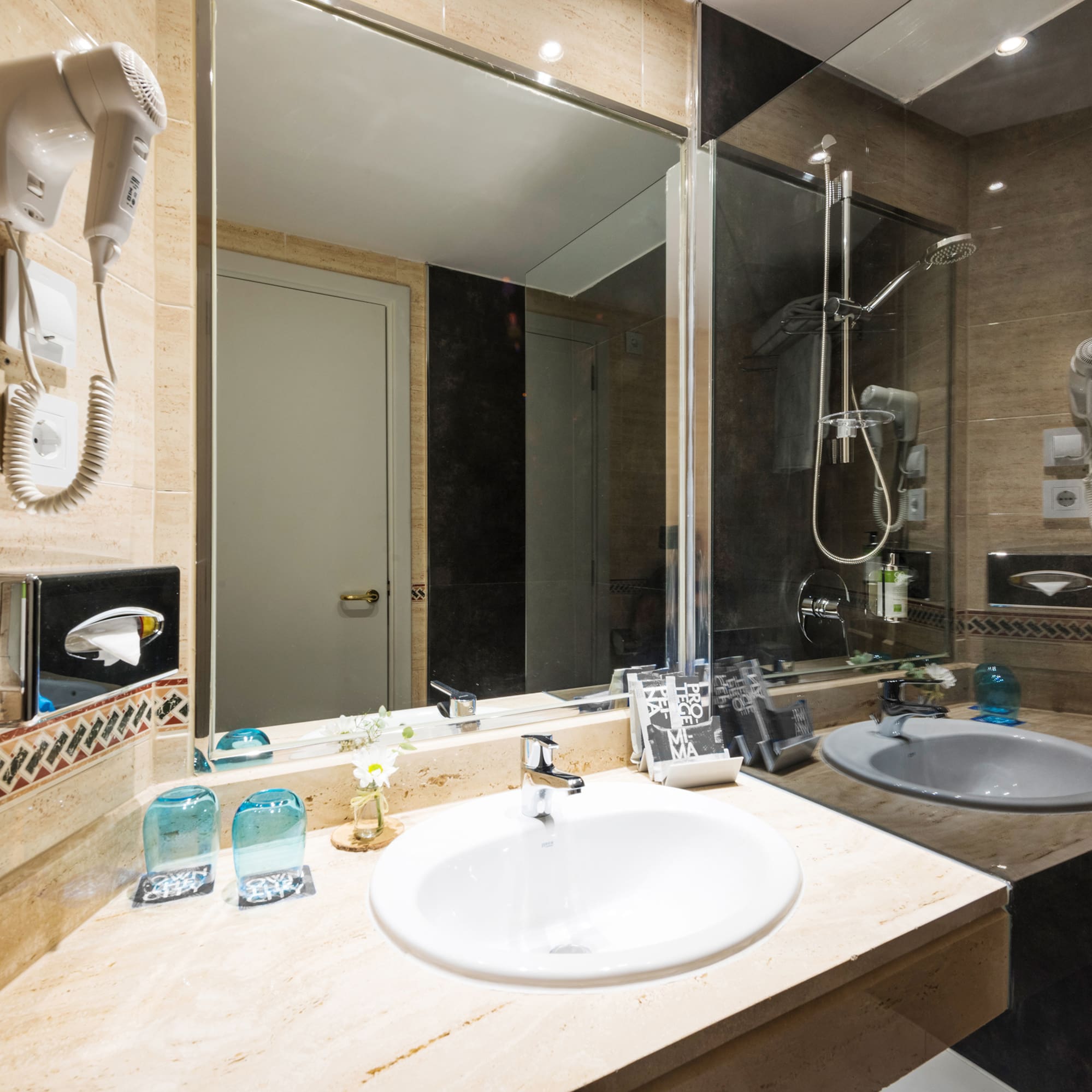 a bathroom with a mirror and sink