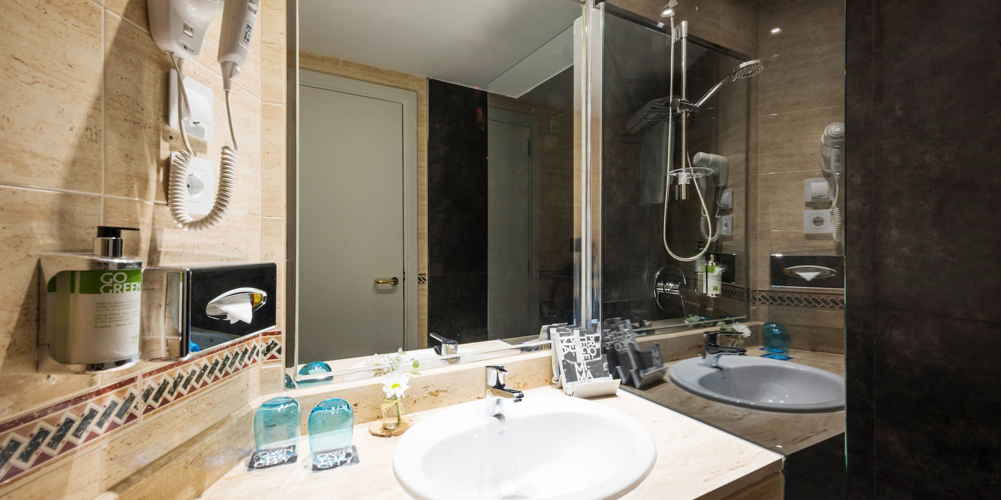 a bathroom with a mirror and sink