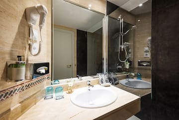 a bathroom with a mirror and sink