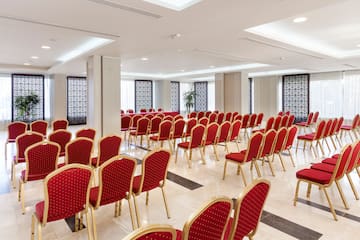 a room with red chairs